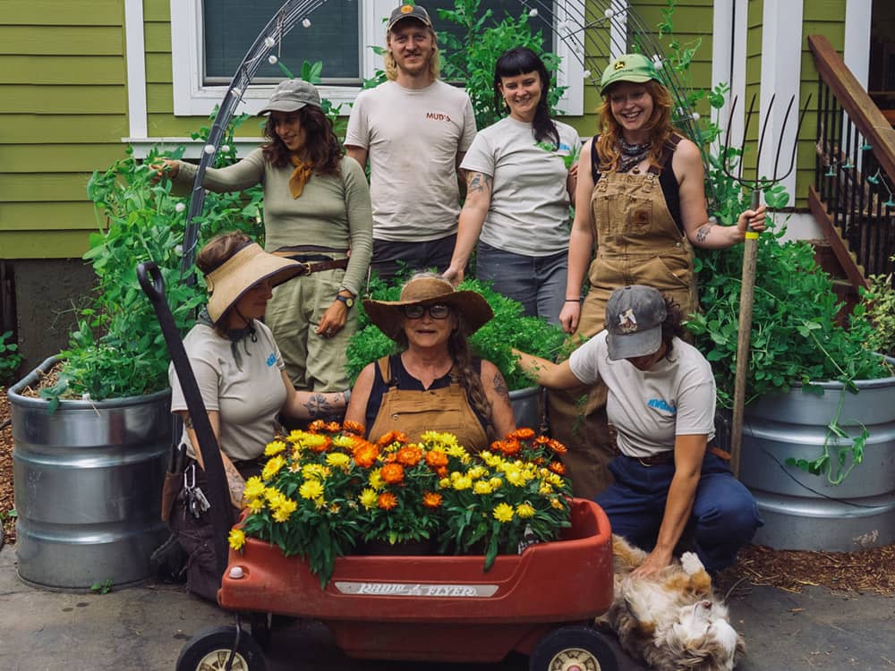 Newgrange team with a wagon of flowers.